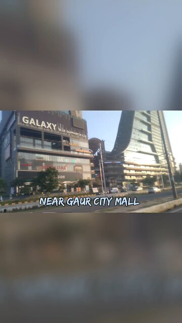 Stunning Skyline: Majestic Skyscrapers Towering Along the Road! #Cityscape #SkyscraperVibes