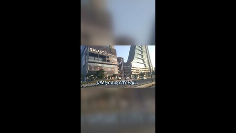 Stunning Skyline: Majestic Skyscrapers Towering Along the Road! #Cityscape #SkyscraperVibes