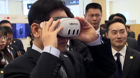 South Korea's Lee shakes hands with humanoid robot in Shanghai