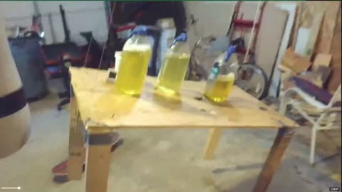 This is... art. Suspended table full of p*ss jugs (2025)