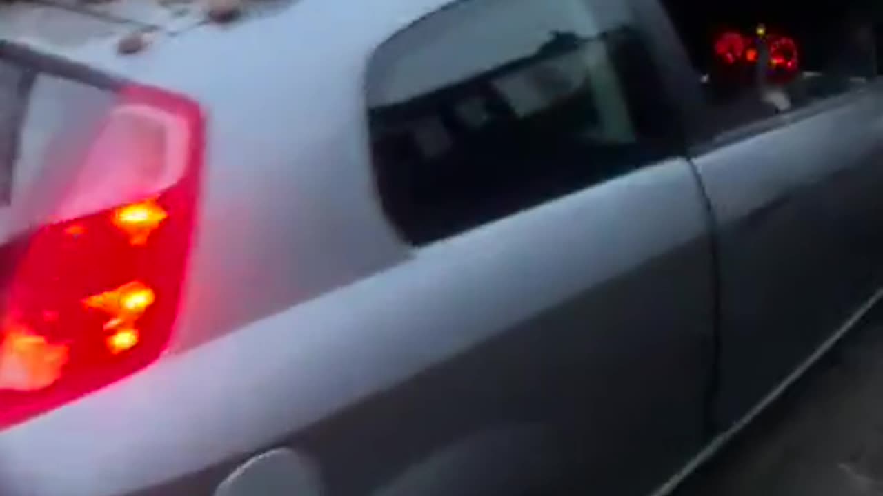Car Waits For Mate Under Fallen Brick Pile