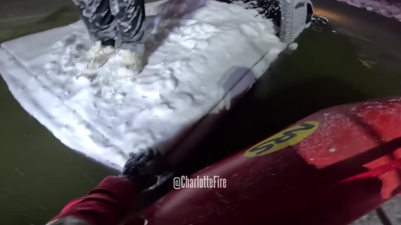 You Can't Park There! Man Rescued from Top of Truck Driven into Frigid Pond