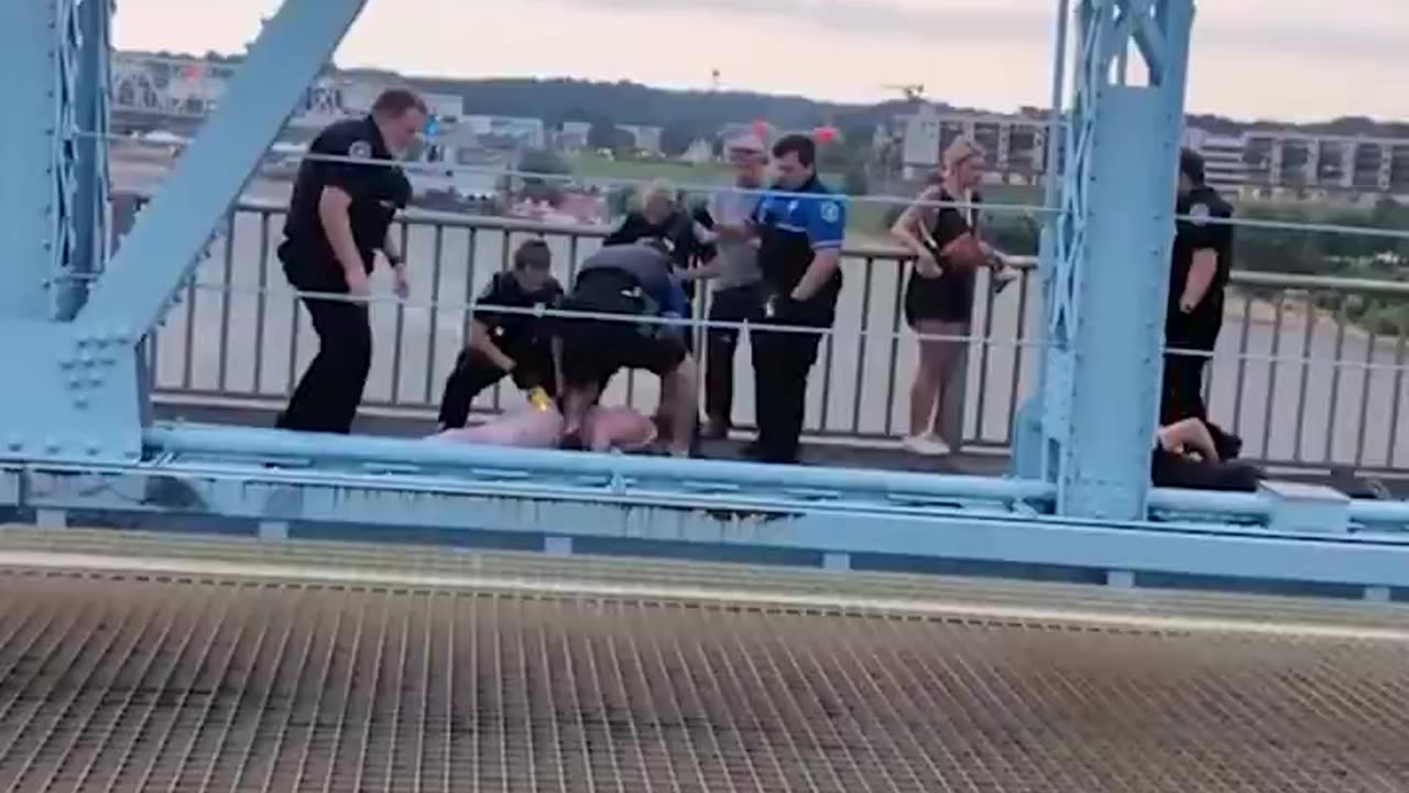 Officers clash with anti-ICE protesters on a bridge on the state line between Ohio and Kentucky