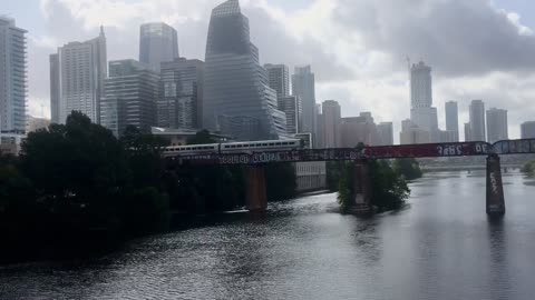 The train going through the beautiful city.