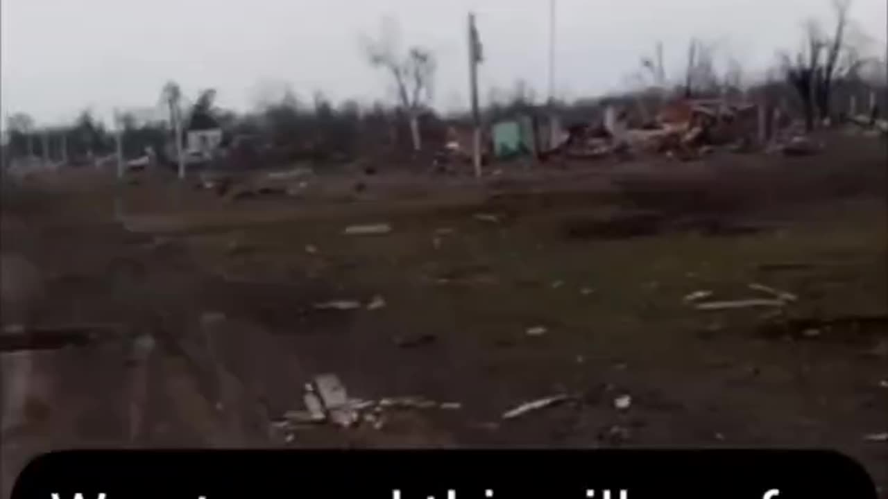 Russian soldiers discuss the results of the assault on a village