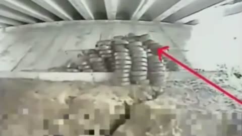 Ukrainian Drone Detonates Massive Stash of Landmines Hidden Under Bridge