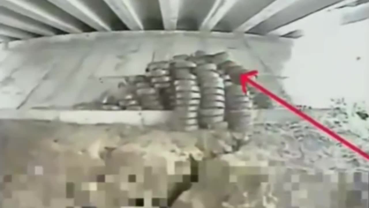 Ukrainian Drone Detonates Massive Stash of Landmines Hidden Under Bridge