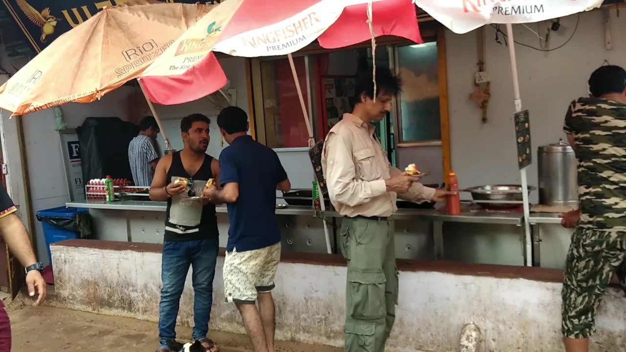 Eating Vada Pav near Calangute Beach in Goa