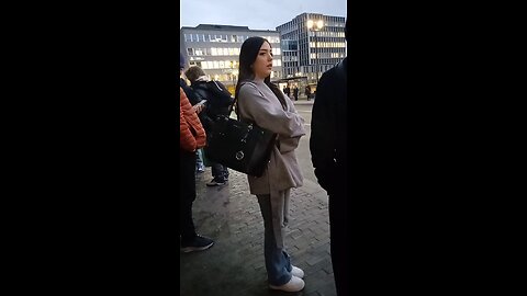 Young beautiful girl is freezing while waiting for the bus.