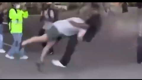 Watch Violently Rioter get his ass Speared after throwing bottle at Cop