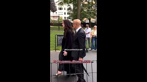Anne Hathaway and Stanley Tucci snap at some photographers in NYC. Hathaway talks down to them