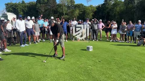Rapper Ja Rule shanks it into a patron at the Derek Jeter Invitational