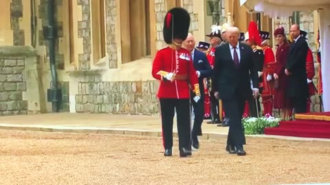 TRUMP WALKS IN FRONT OF supposed "KING" of UK wears purple tie, Melania "purple" hat aka: "ROYALTY"