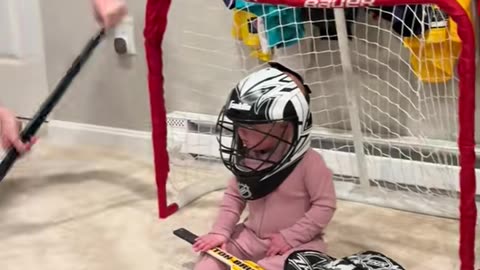 Older Brothers Playing Hockey Against Their 8 Month Old Sister