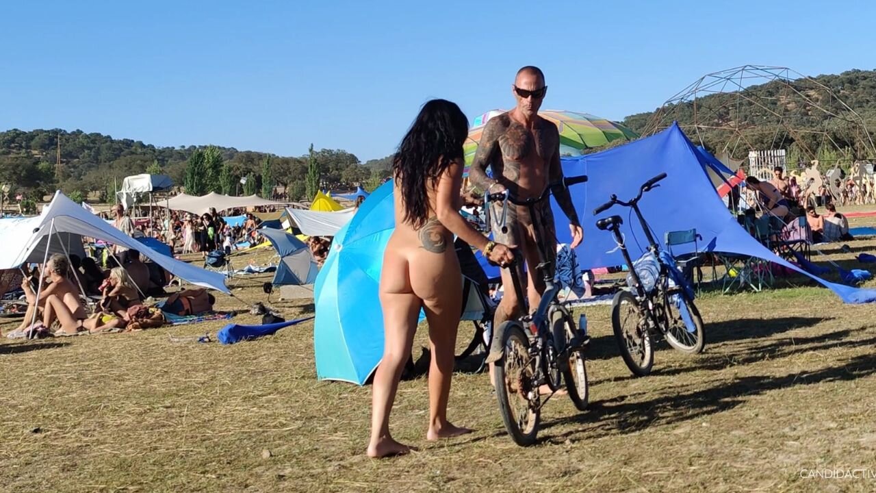 Naked couple chilling at festival