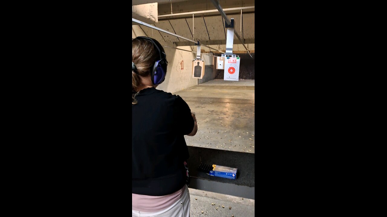 Lady with a 45acp range training one-handed