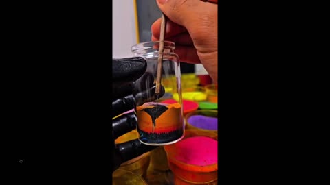 Interesting how he does it: Sand art in a bottle - never saw one made before