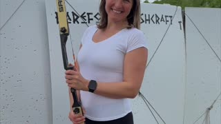 In the stillness of the range, she draws the bow with purpose — no noise, no rush.