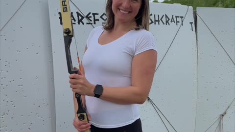 In the stillness of the range, she draws the bow with purpose — no noise, no rush.