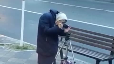 Old woman photographer