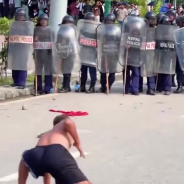 Shaolin show off shakes riot police boots in Nepal amid deadly protests.