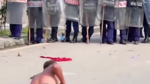Shaolin show off shakes riot police boots in Nepal amid deadly protests.
