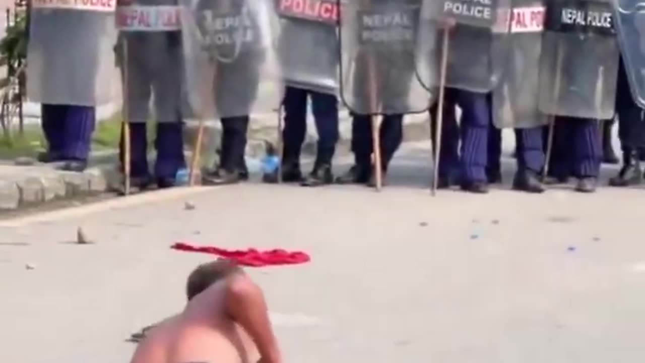 Shaolin show off shakes riot police boots in Nepal amid deadly protests.