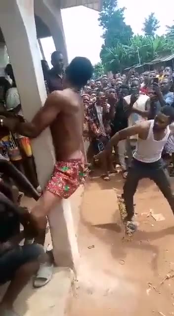 African nigger being whipped