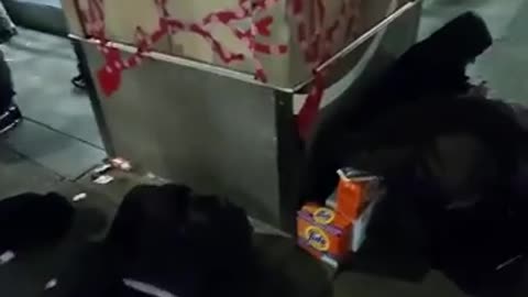 Looters gather in front of a Walgreens to sell items they've just shoplifted