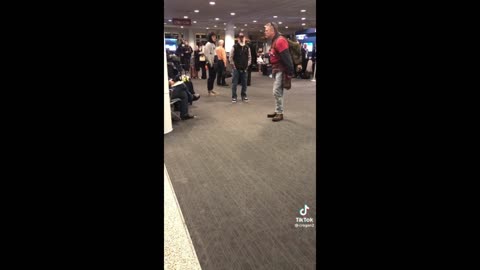 Man performs a musical at the Airport