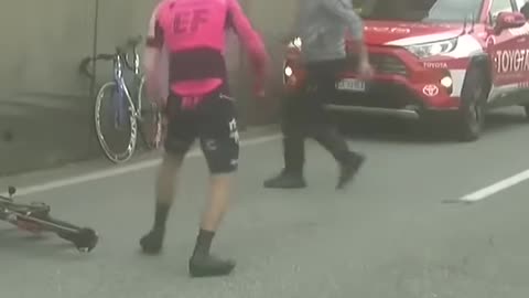 OUCH Bettiol is knocked off his bike by an official who was helping with another crash #crash