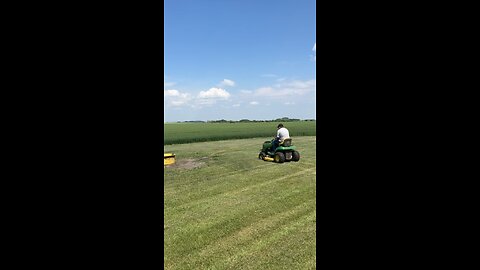 tim mowing his lawn