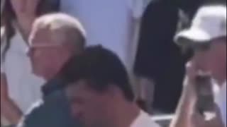 SUSPICIOUS HAND GESTURES BEHIND CHARLIE KIRK.