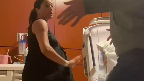 Meghan pretending she's getting ready to have Lily