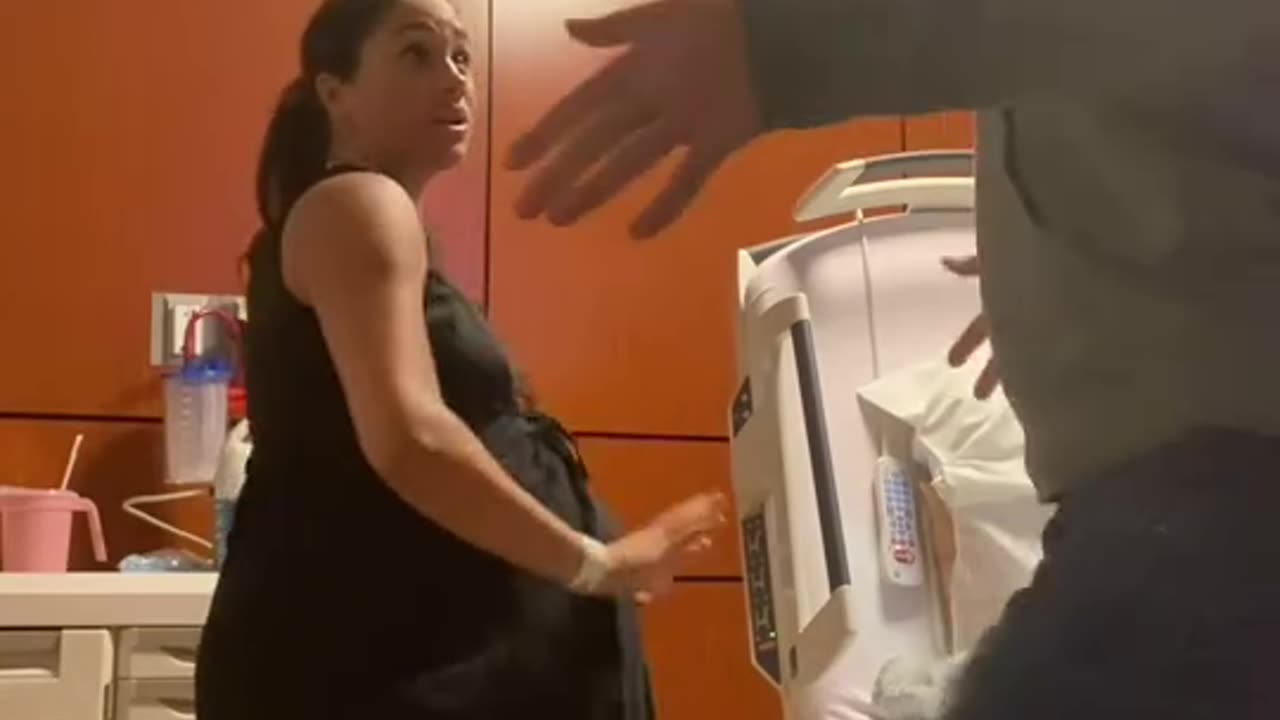 Meghan pretending she's getting ready to have Lily