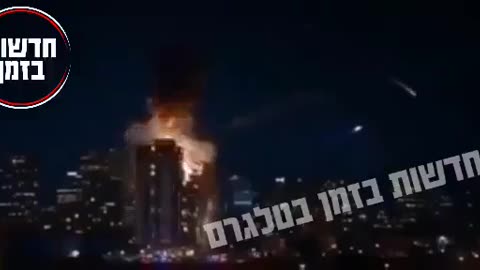 This is happening right now in Israel. A ballistic missile just chopped a building in half