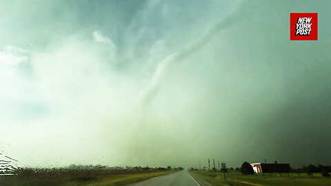 Video footage shows suspected tornado ripping through Kansas town causing severe damage