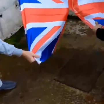 Muslim immigrants in the UK were filmed ripping up a British flag while...