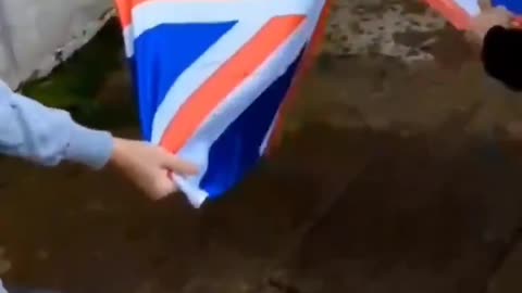 Muslim immigrants in the UK were filmed ripping up a British flag while...