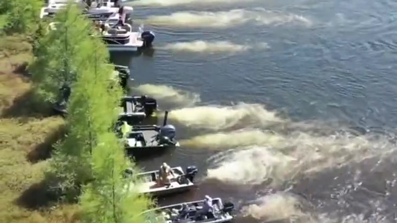 Boat owners moving a large floating island out of the way on Wisconsin's Lake Chippewa.