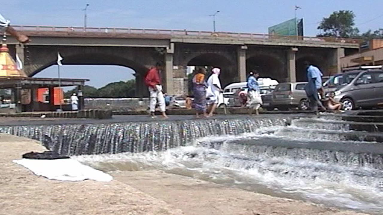 The bridge and Waterfall view of Ramkund, Godavari River, Nashik