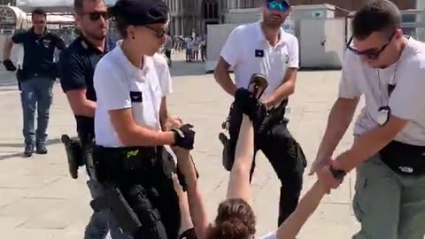 They protest Jeff Bezos and Lauren Sanchez's wedding in Venice and are taken away like this.
