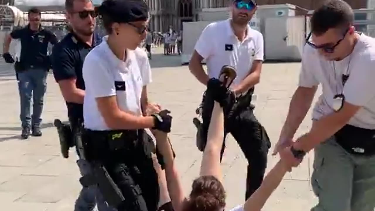 They protest Jeff Bezos and Lauren Sanchez's wedding in Venice and are taken away like this.