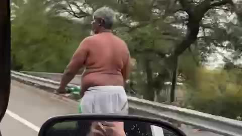 Highway Hero? This Homeless Man's Scooter Stunt Will Leave You Speechless!