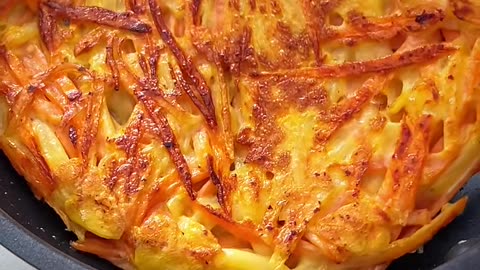 A potato and carrots pancake, stuffed with beef and shredded mozzarella cheese