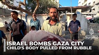 Israeli air attack kills sleeping families in Gaza City as rescuers pull child's body from rubble
