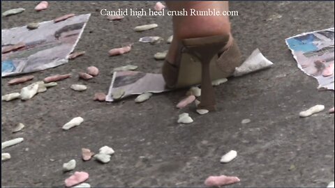 Candid and unknown walking by candy crushing with high heels