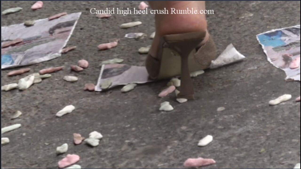 Candid and unknown walking by candy crushing with high heels