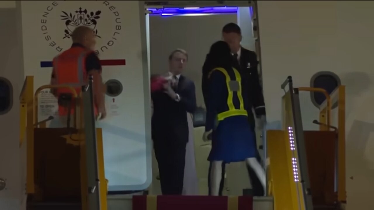 President Macron's wife appears to push him in the face