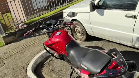 Boy Rides Bicycle Into Motorcycle's Tail